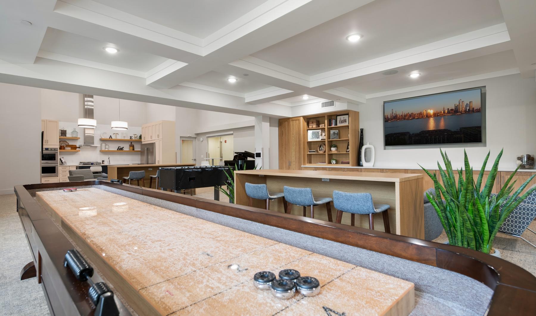 a kitchen with a bar and chairs