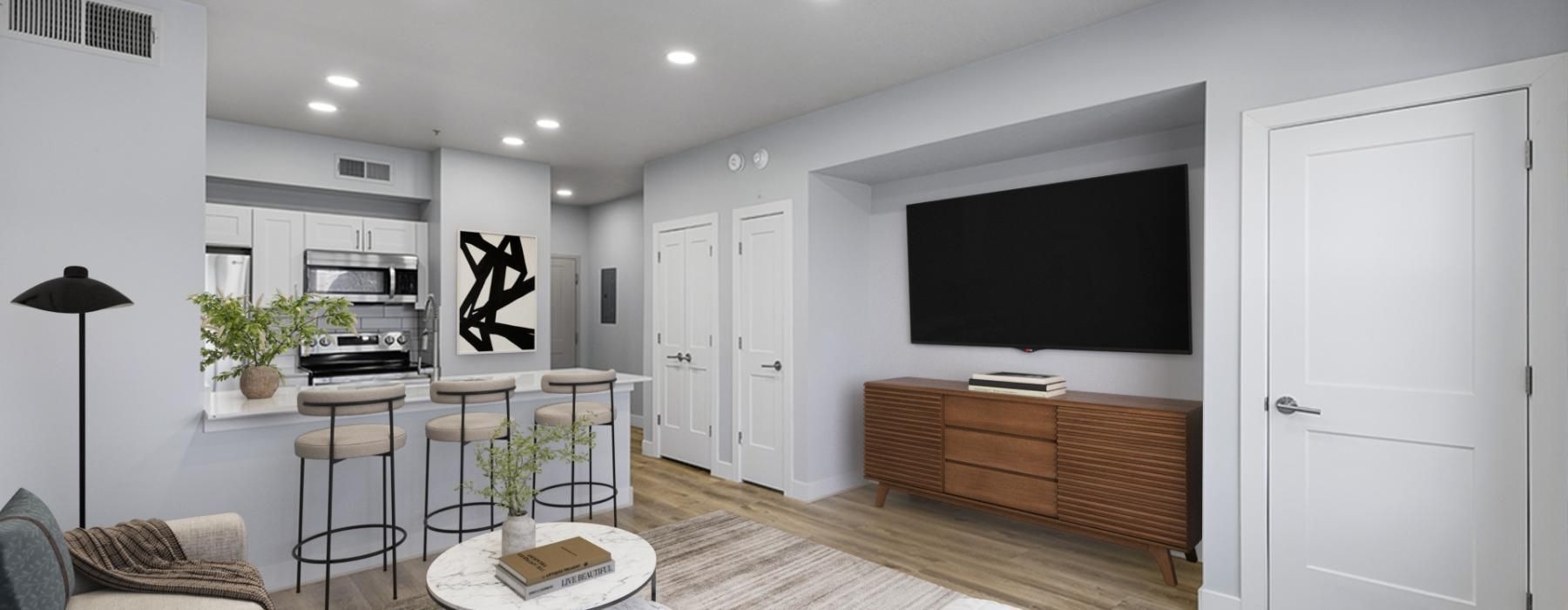 a living room with a tv and furniture