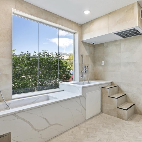 a bathroom with a tub and a window